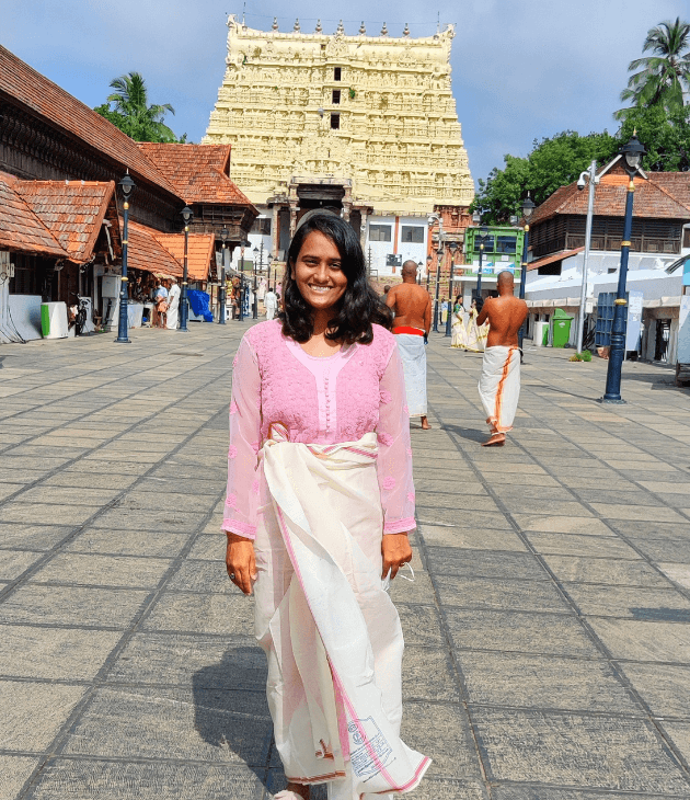 Outside Padmanabhaswamy temple in Trivandrum following the dress code for South Indian temples.