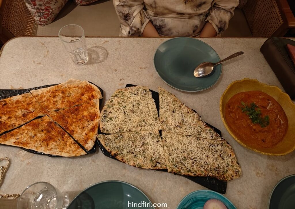 Food at the tiger naan cafe. The tiger naan, cheese garlic naan, and chicken tikka masala.