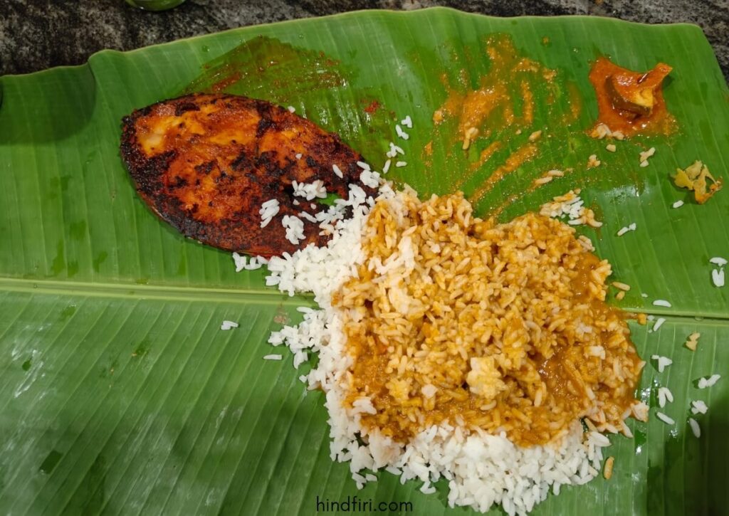 White rice with fish curry and a side of surmai fish fillet. 